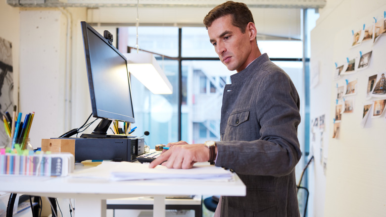 Man working at a standing desk