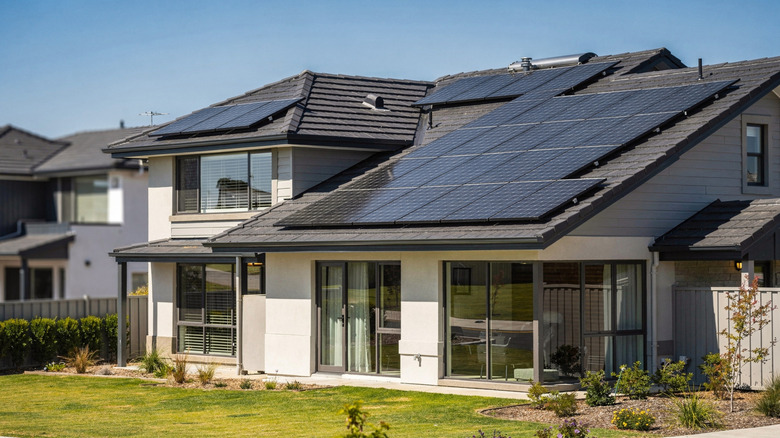 A modern home with solar panels on the roof