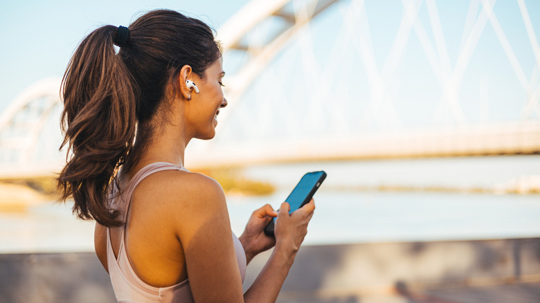 A person using AirPods while exercising