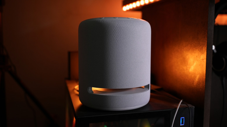 An Amazon Echo Studio (1st Gen) set up on top of an AV rack.