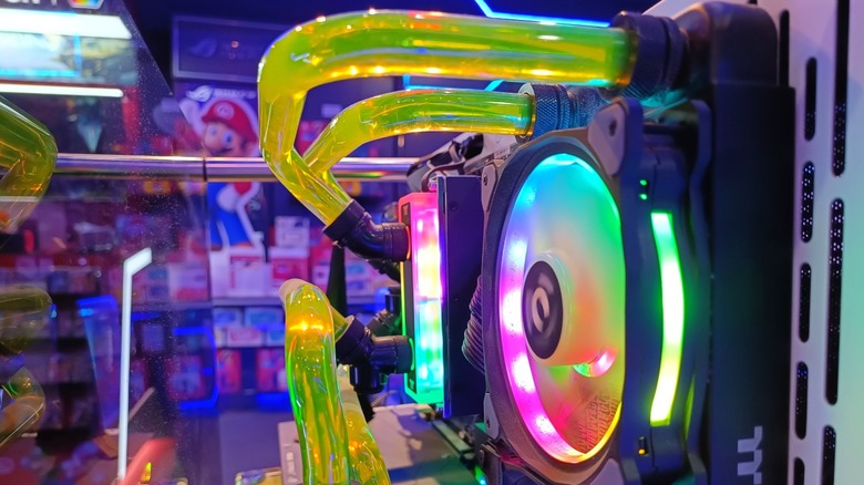 Green liquid inside a custom liquid cooling loop for a PC.