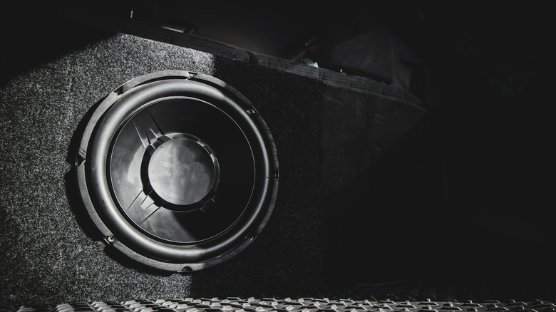 Subwoofer sitting in the trunk of a car