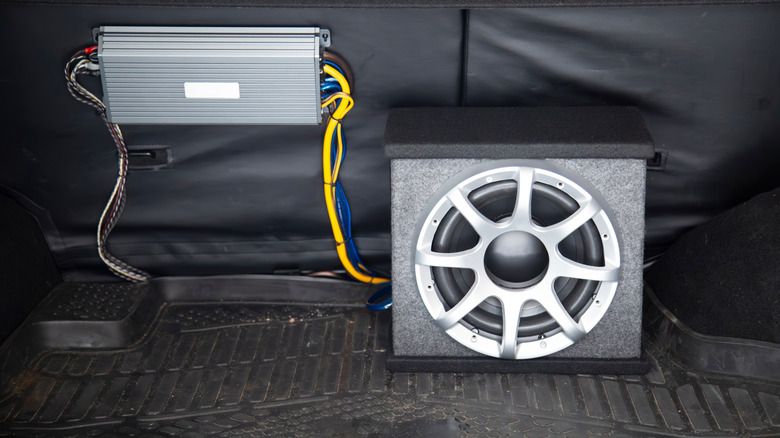 A subwoofer is a sealed enclosure connected to an amp in a car