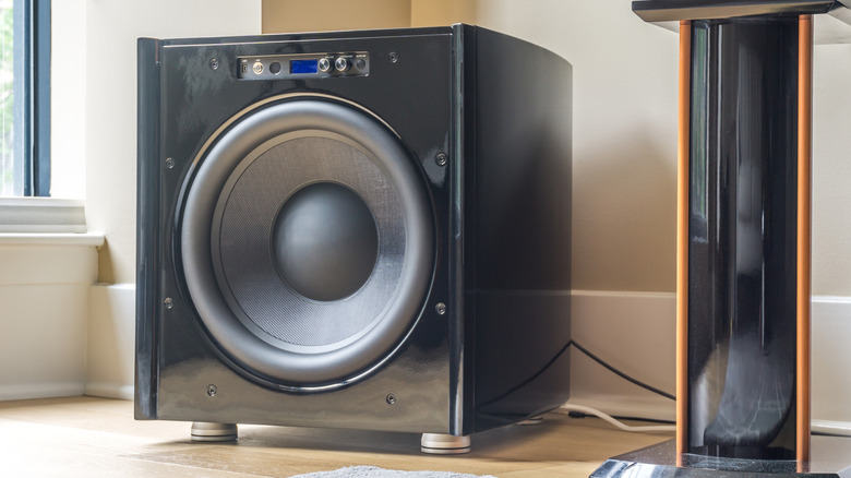 A subwoofer shown alongside floorstanding speaker
