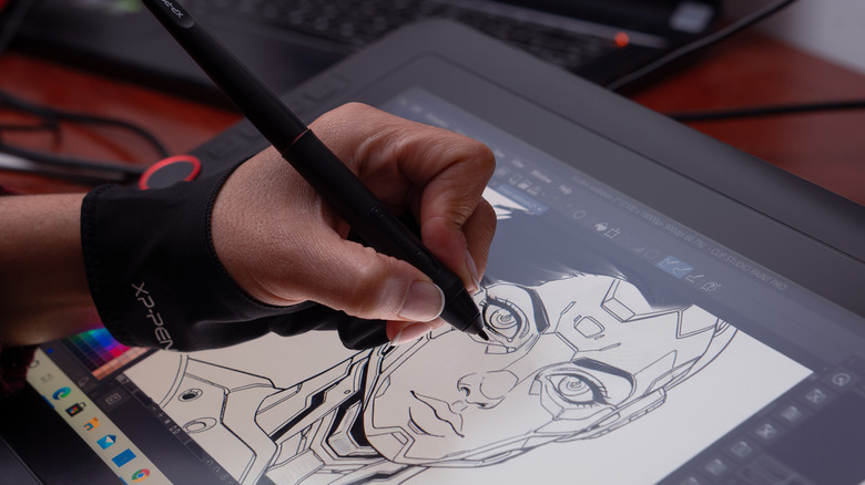 a person drawing on a drawing tablet