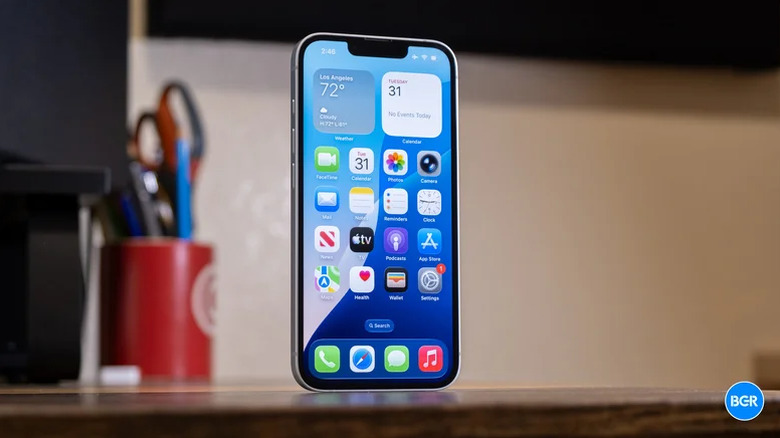 The iPhone 17e on a table, with the screen turned on.