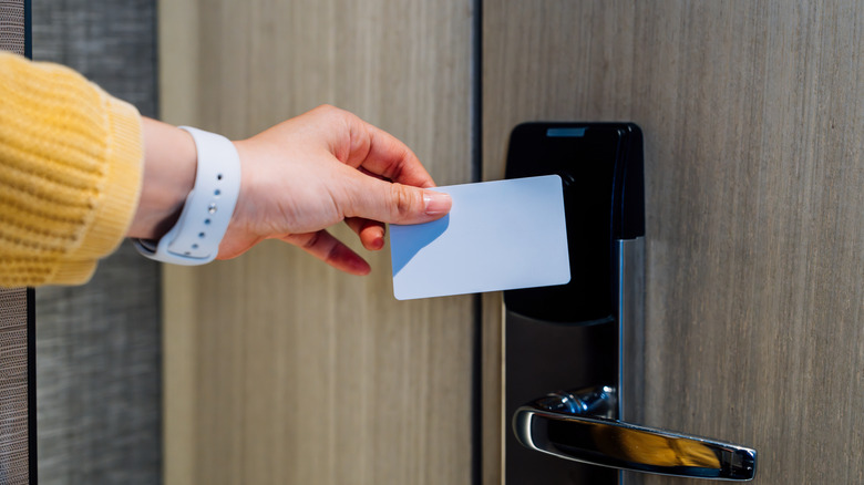 opening a hotel room with an access card