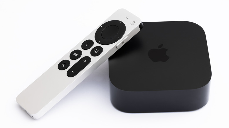 An Apple TV streaming device and included Siri remote