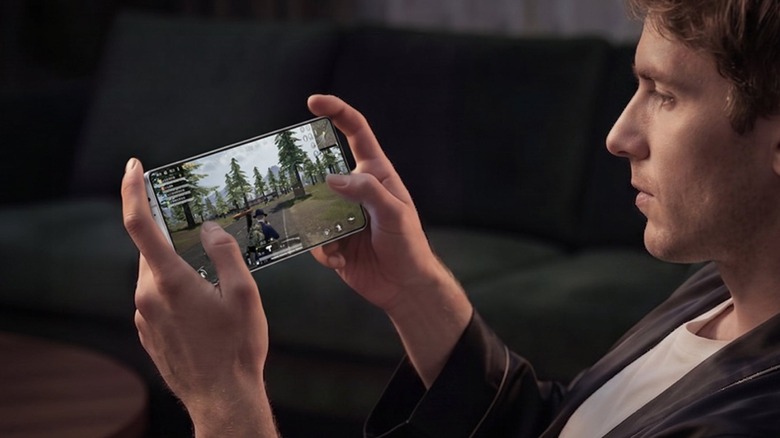 Man playing PUBG on RedMagic 11S Pro gaming smartphone