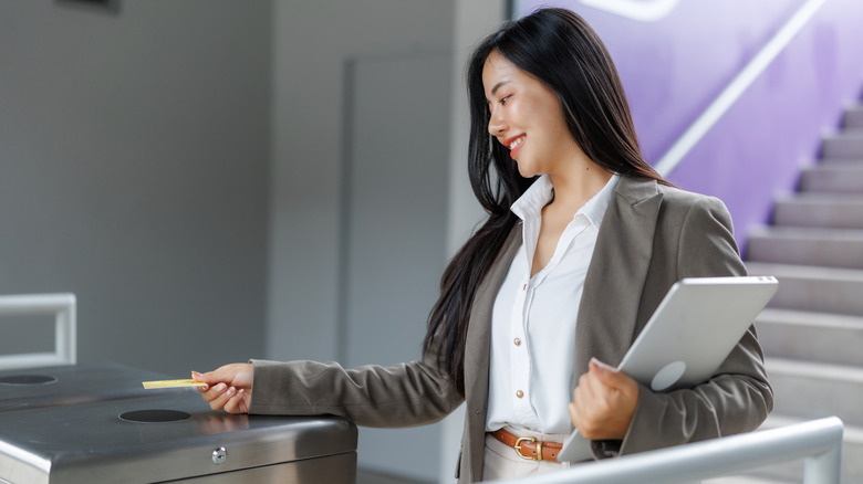 A person using security badge at work