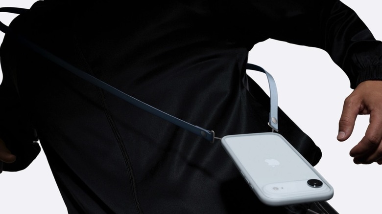 A person using a Crossbody Strap with the iPhone Air.