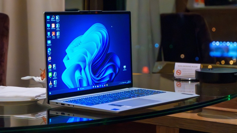 A Windows laptop on a glass table
