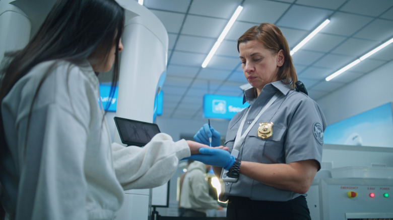 Close-up of a TSA hand swab screening to check for dangerous substances.