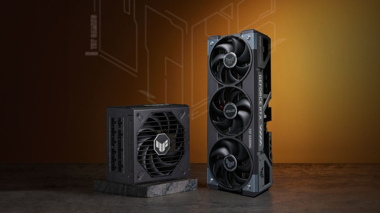 ASUS RTX 5090 GPU next to PSU in front of orange and black background with logo