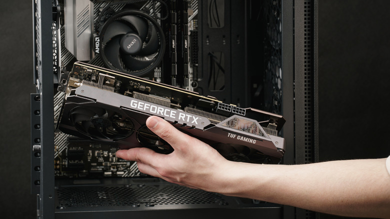 An Nvidia Geforce graphics card being installed into a PC