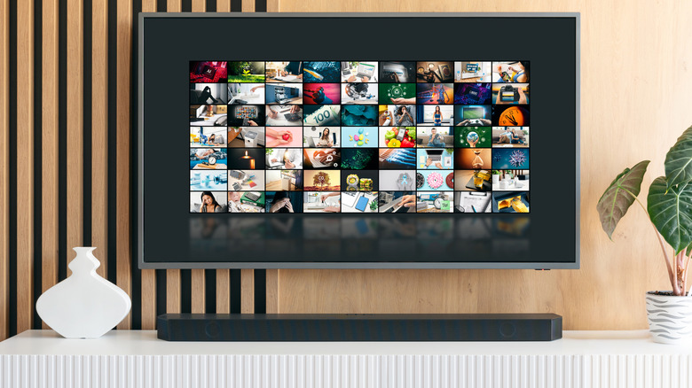 a soundbar underneath a wall-mounted TV