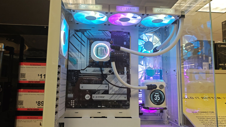 A retail PC display featuring a Corsair all-in-one cooling system.