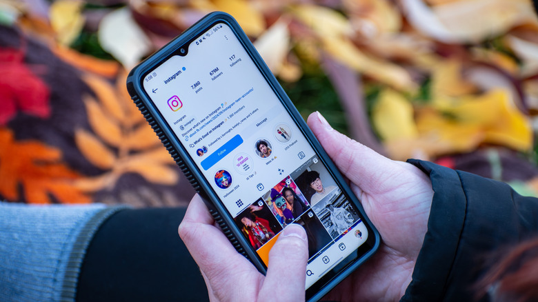 A person looking at the Instagram profile on an Android phone.