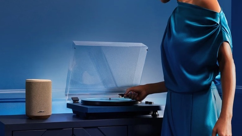 Bose Lifestyle Ultra on table next to vinyl player