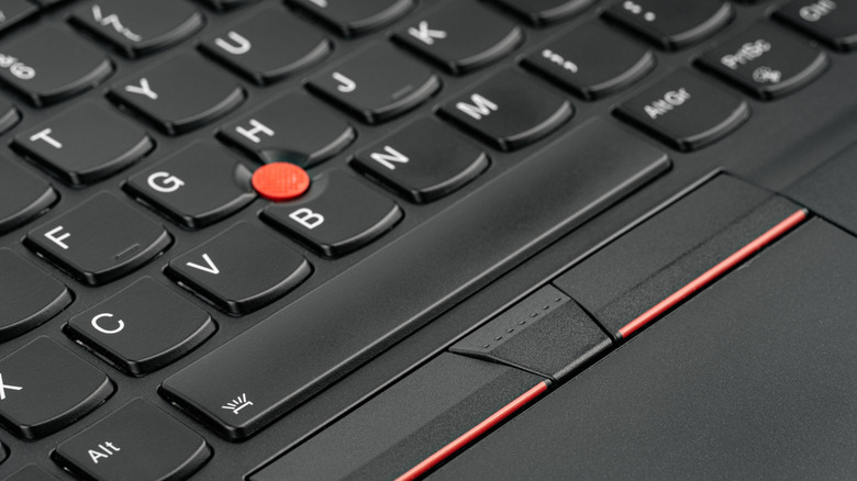 close-up of lenovo laptop keyboard with trackpoint visible