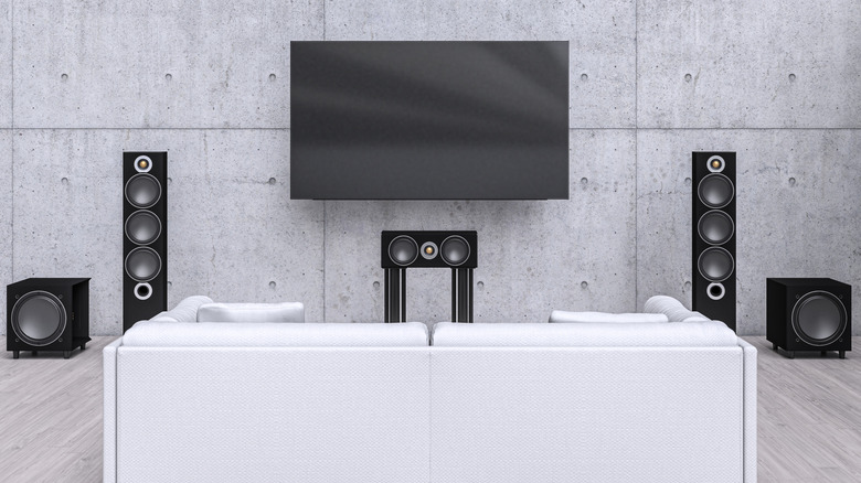 A modern home theater setup with speakers and a TV