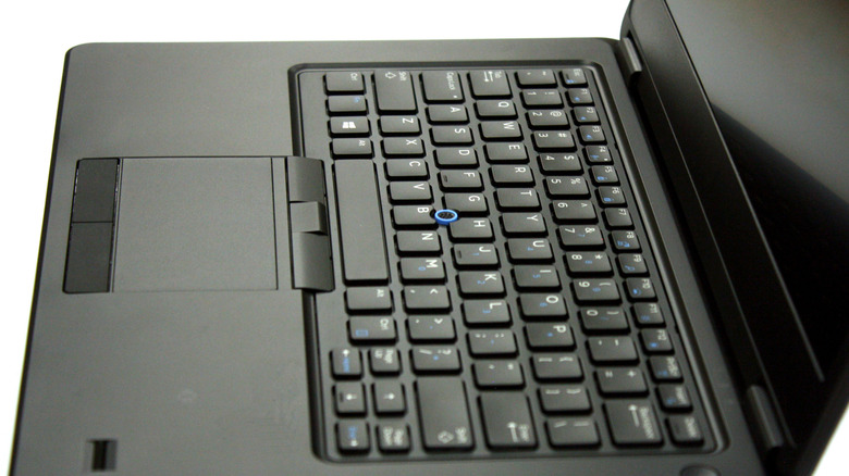 Side view of a open laptop keyboard, with a set of function keys