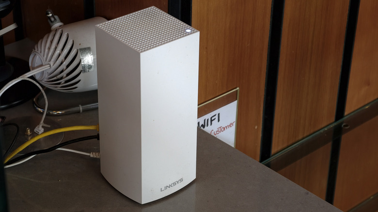 A Linksys router transmitting a public Wi-Fi signal at a restaurant.