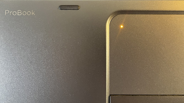 solid orange light on touchpad on an HP ProBook laptop