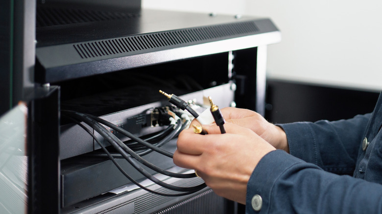 Organizing cables to set up an automated home theater