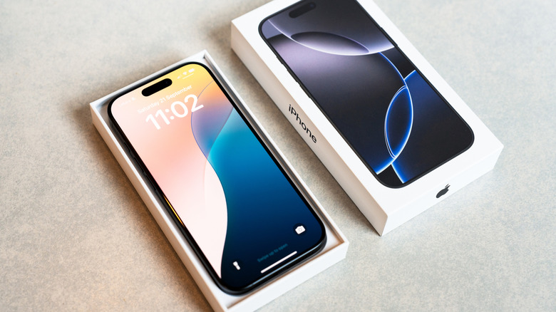 Close up of an Apple iPhone 16 Pro in retail packaging.