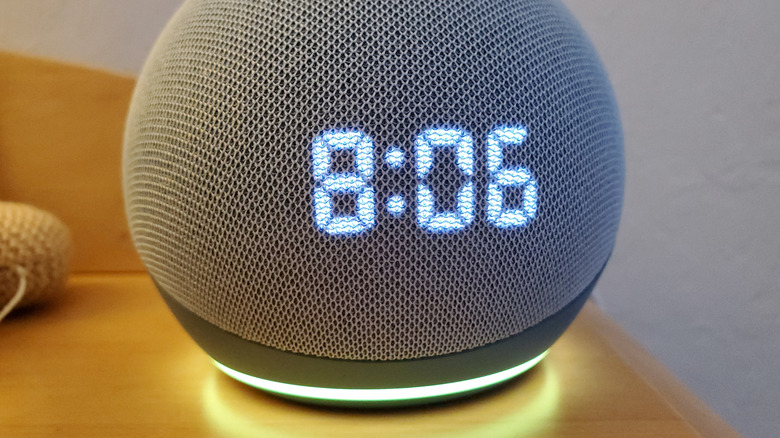 An Amazon Echo Dot Clock with a yellow LED light ring