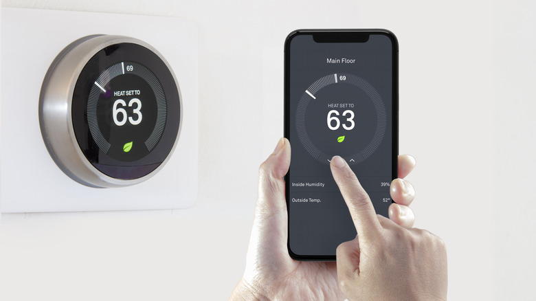 Smartphone controlling temperature on thermostat