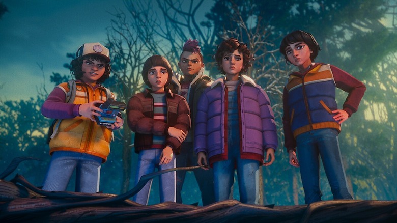 Dustin, Will, Nikki, Eleven, and Mike looking down at something