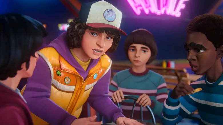 Dustin explaining something to his friends