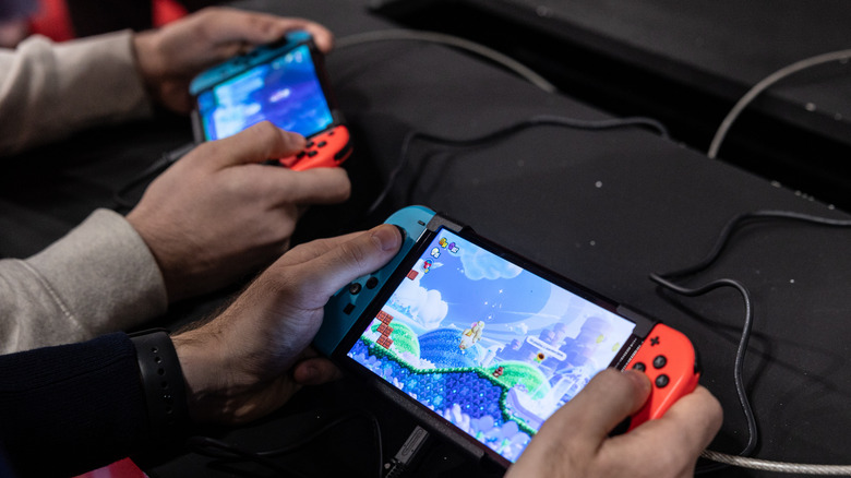 Two people playing games on the Nintendo Switch 2