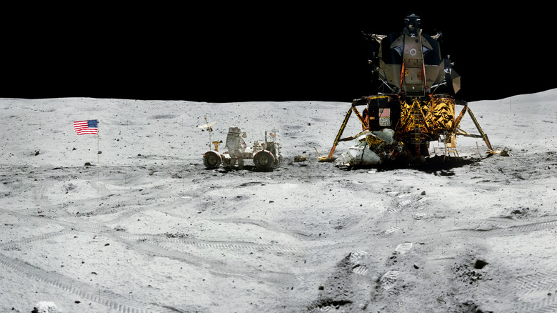 Astronaut working on a lunar vehicle on the moon