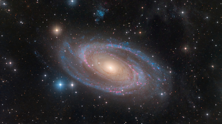 Image of a galaxy and neighboring celestial objects