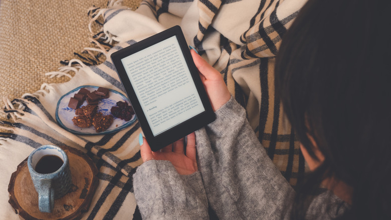 A person reading from an e-reader