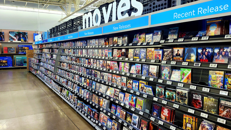 A bunch of movies for sale at a store