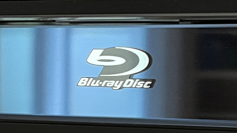 A close-up shot of the Blu-ray Disc logo on a Blu-ray player