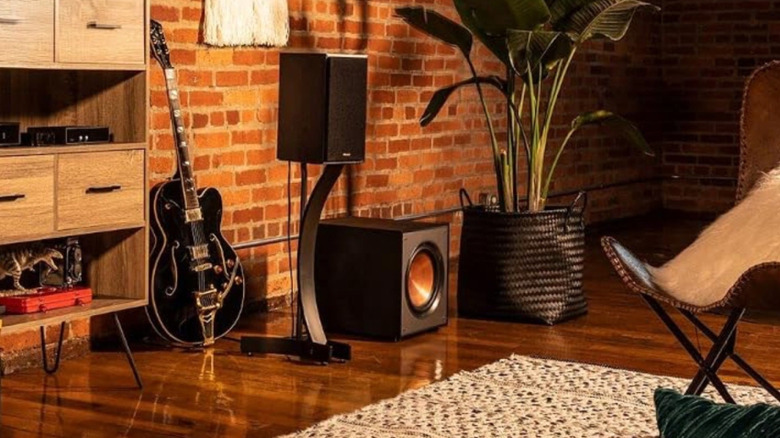 A Klipsch active subwoofer in a modern living room.
