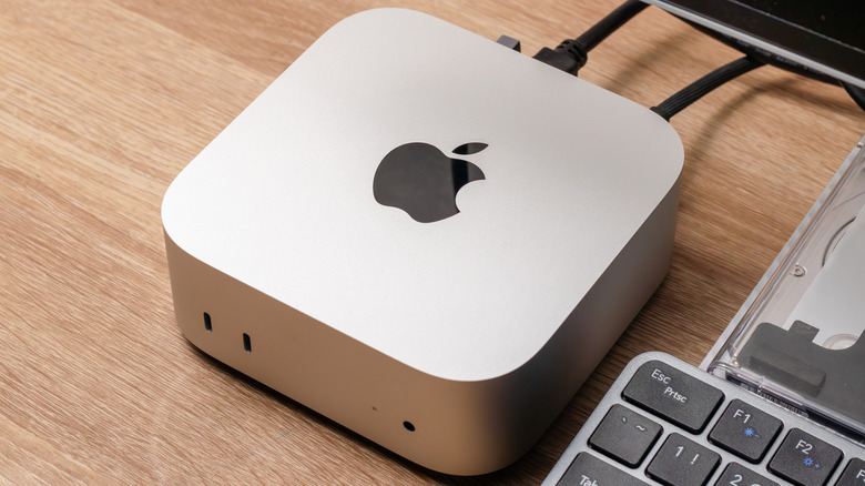 Mini PC on table near keyboard and monitor