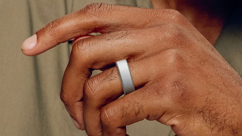 Close up of a person wearing an Oura ring