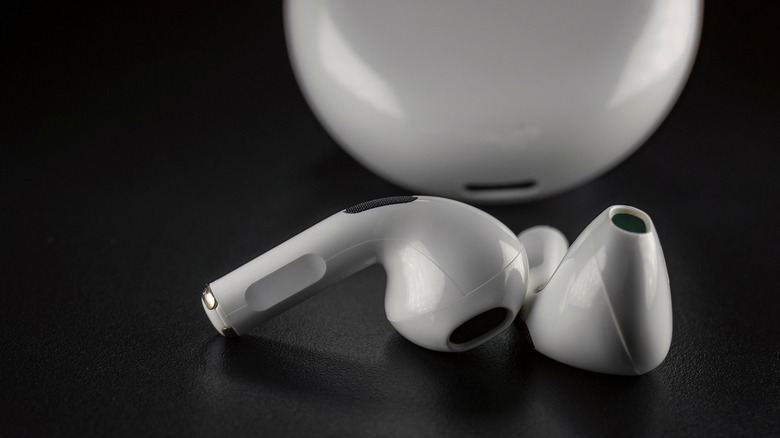 AirPods on a black background.