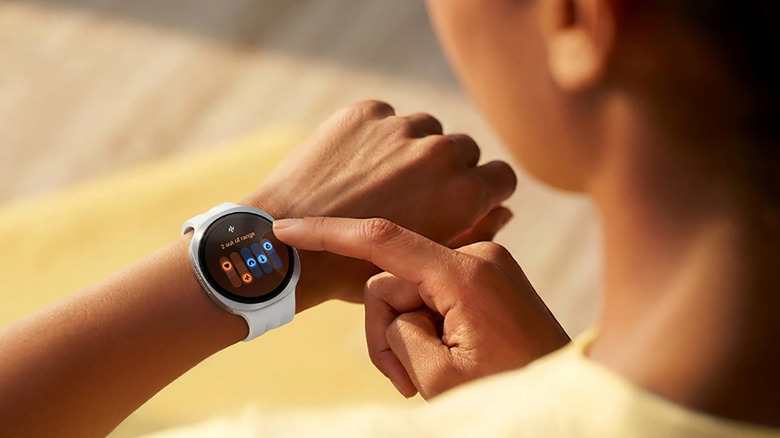 A woman checking her vitals on the Samsung Galaxy Watch 9.