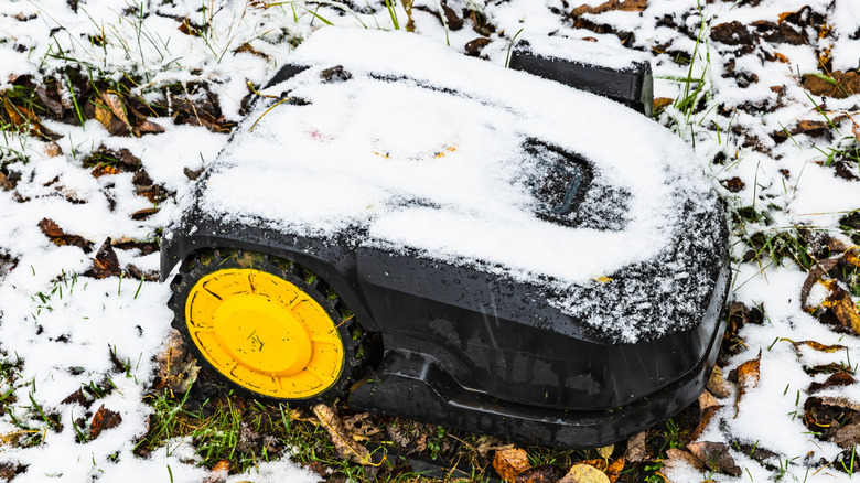 Robot mower with snow on it