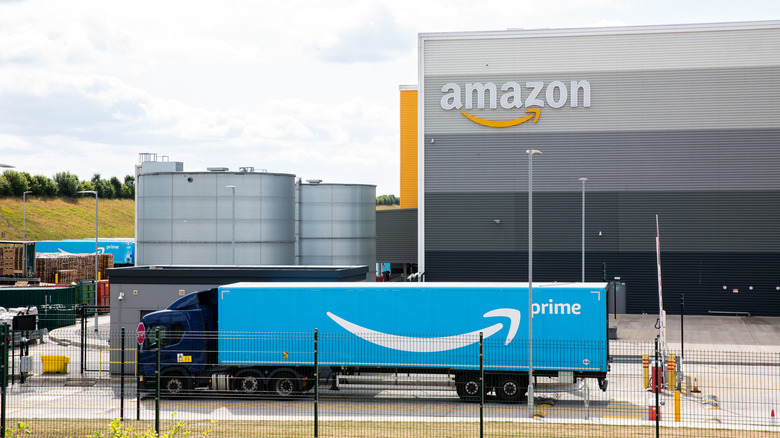 Amazon truck arriving at company warehouse