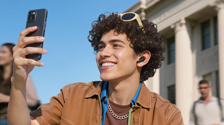 A man wearing the Soundcore P31i Wireless Earbuds in an outdoor setting.