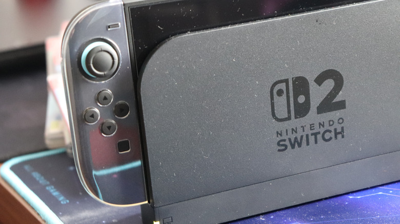 Nintendo Switch 2 dock and Joy-Con shown in close-up with the logo visible.