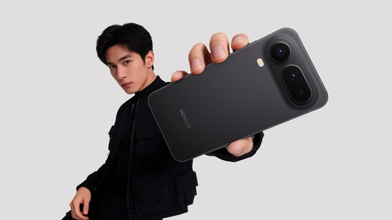 The Honor Magic 8 Pro Air in hand, with rear cameras visible